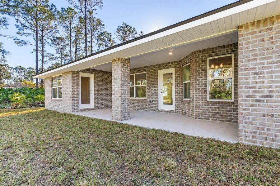 Representative exterior photo of a completed home built from the 2265 by Adams Homes in Royal Highlands, Spring Hill, FL (Image 28).