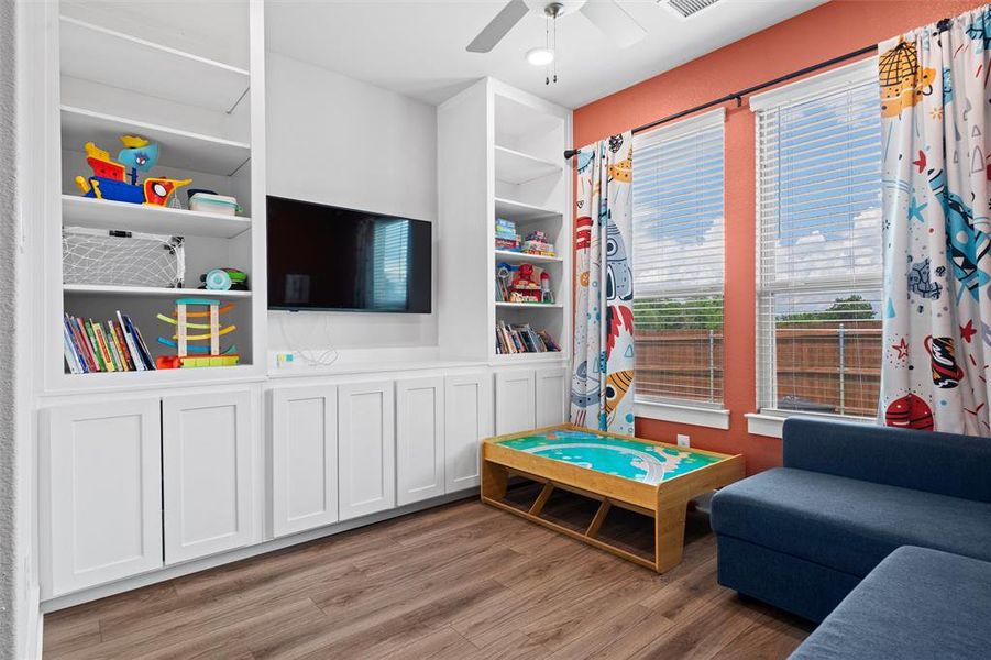 The flex room has very useful built-in cabinets for a variety of uses.