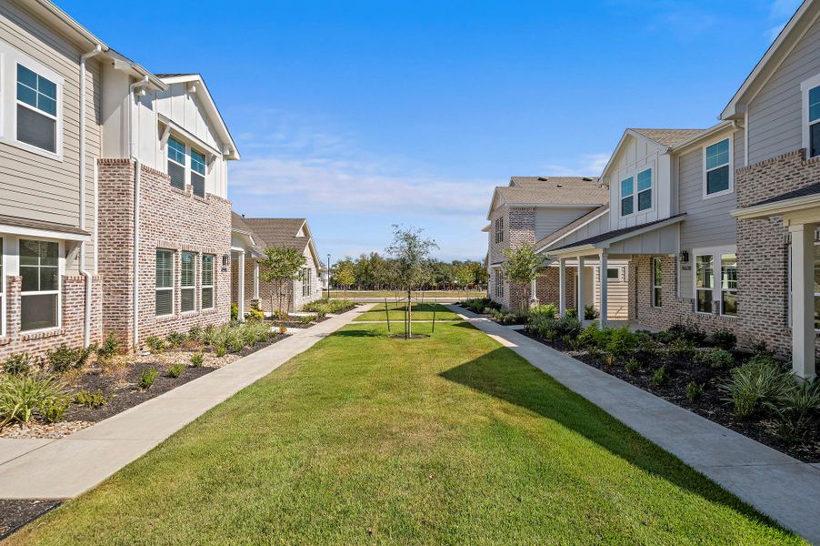 Front exterior of a new home in , Buda, TX, highlighting curb appeal (Image 16).