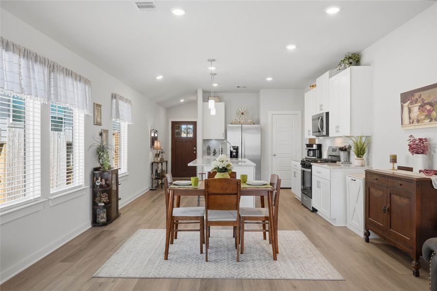 The cozy dining area creates a warm space to enjoy meals with family and friends.