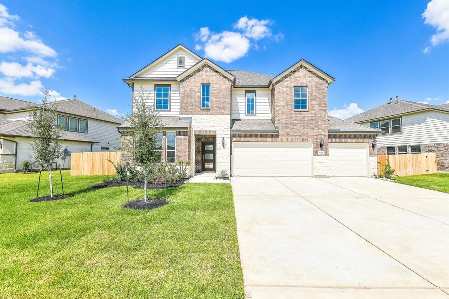 Front exterior of a new home in Stone Creek Ranch, Hockley, TX, highlighting curb appeal (Image 2).