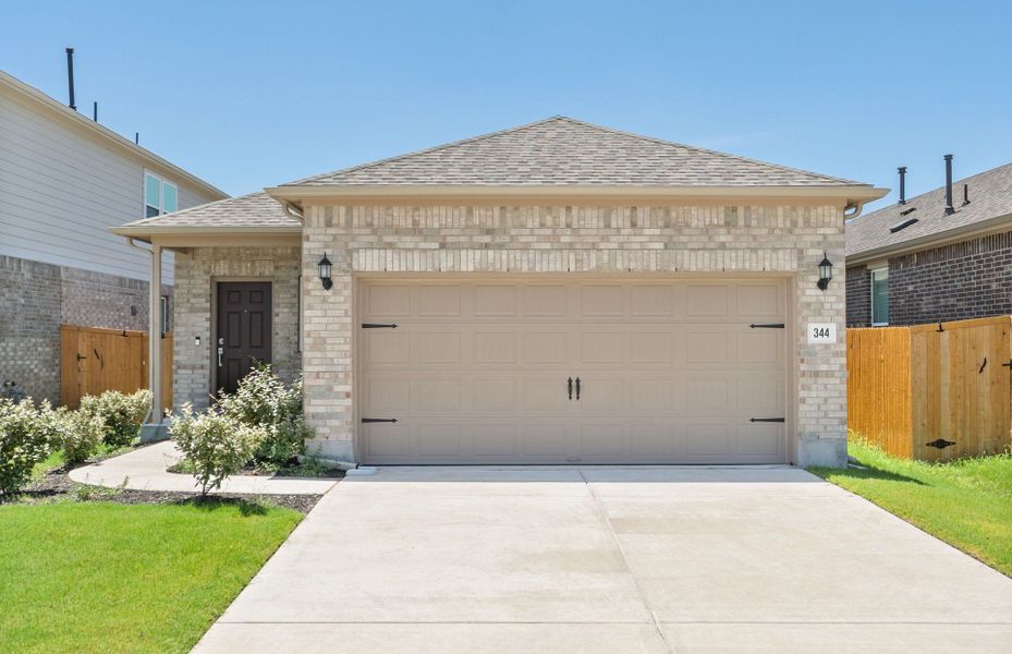 Front exterior of a new home in Crosswinds, Kyle, TX, highlighting curb appeal (Image 2). Front exterior of a new home in Crosswinds, Kyle, TX, highlighting curb appeal (Image 2).