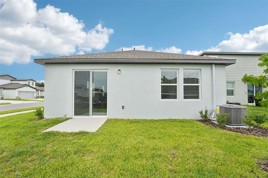 Front exterior of a new home in The Grove at Stuart Crossing - Premier Series, Bartow, FL, highlighting curb appeal (Image 2). Front exterior of a new home in The Grove at Stuart Crossing - Premier Series, Bartow, FL, highlighting curb appeal (Image 2).