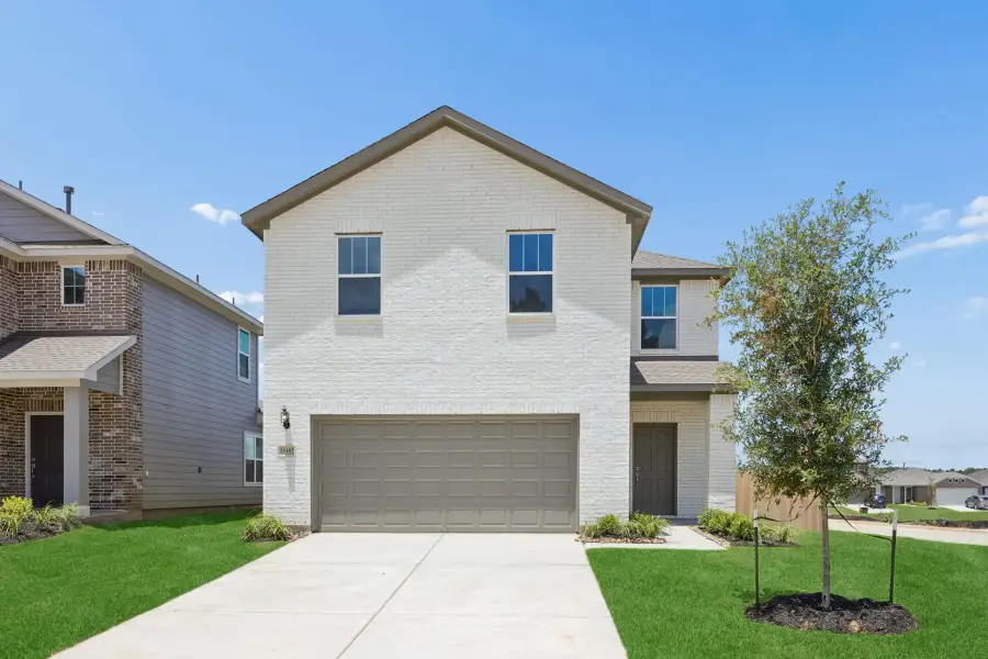 Front exterior of a new home in Magnolia Springs, Montgomery, TX, highlighting curb appeal (Image 1). Front exterior of a new home in Magnolia Springs, Montgomery, TX, highlighting curb appeal (Image 1).