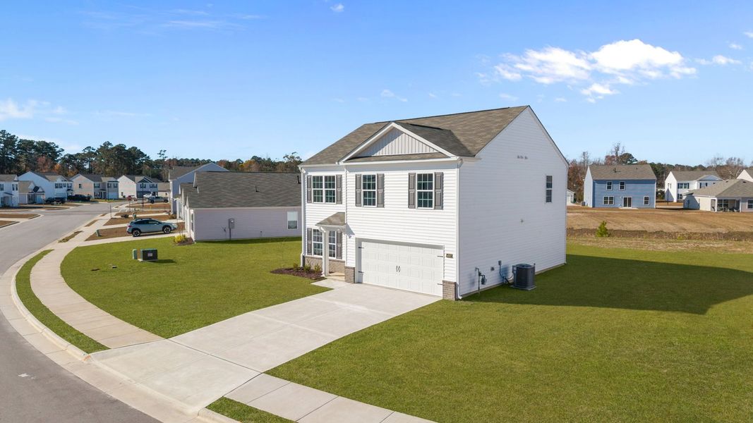 Front exterior of a new home in Madeline Farm, New Bern, NC, highlighting curb appeal (Image 17).