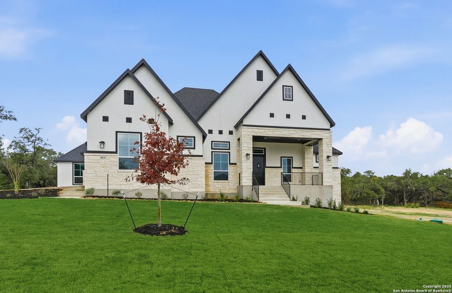 Front exterior of a new home in Heimer Estates at Garden Ridge, San Antonio, TX, highlighting curb appeal (Image 27).