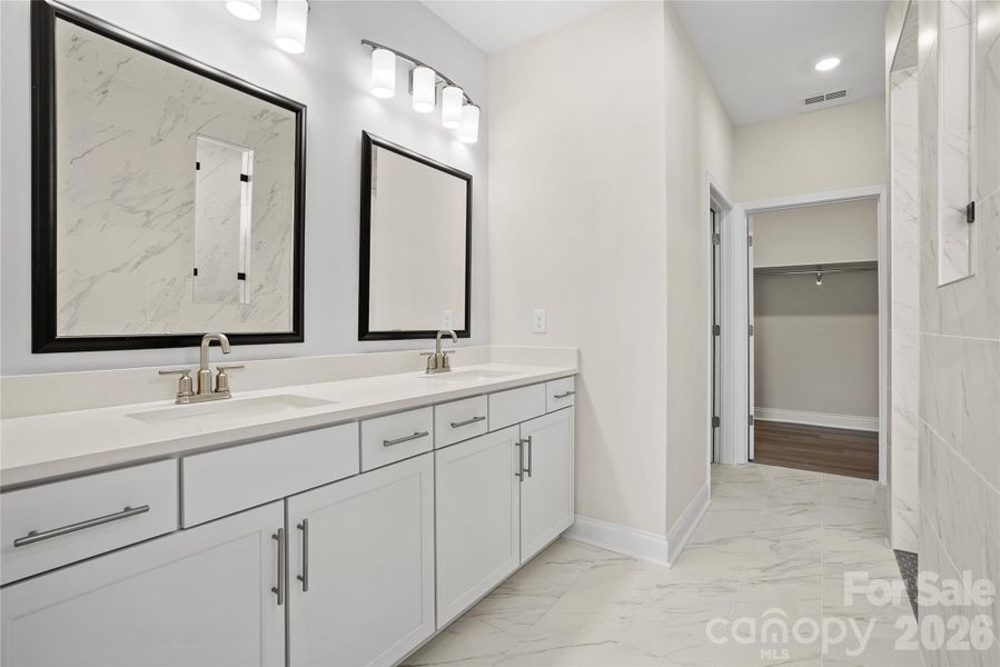 Luxurious primary bathroom with designer upgrades