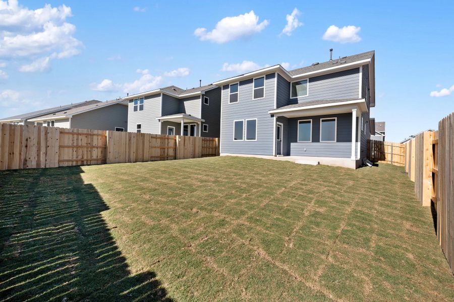 Exterior details and patio area of a home in The Homestead at Lariat, Liberty Hill (Image 31).