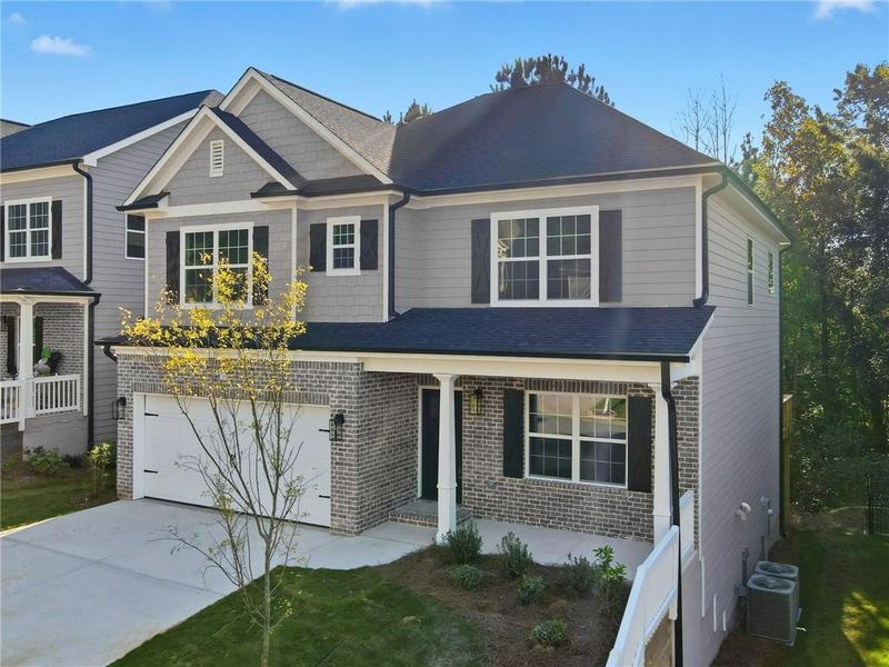 Front exterior of a new home in , Canton, GA, highlighting curb appeal (Image 25).