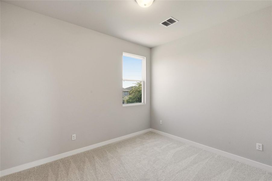 Unfurnished room with carpet and baseboards