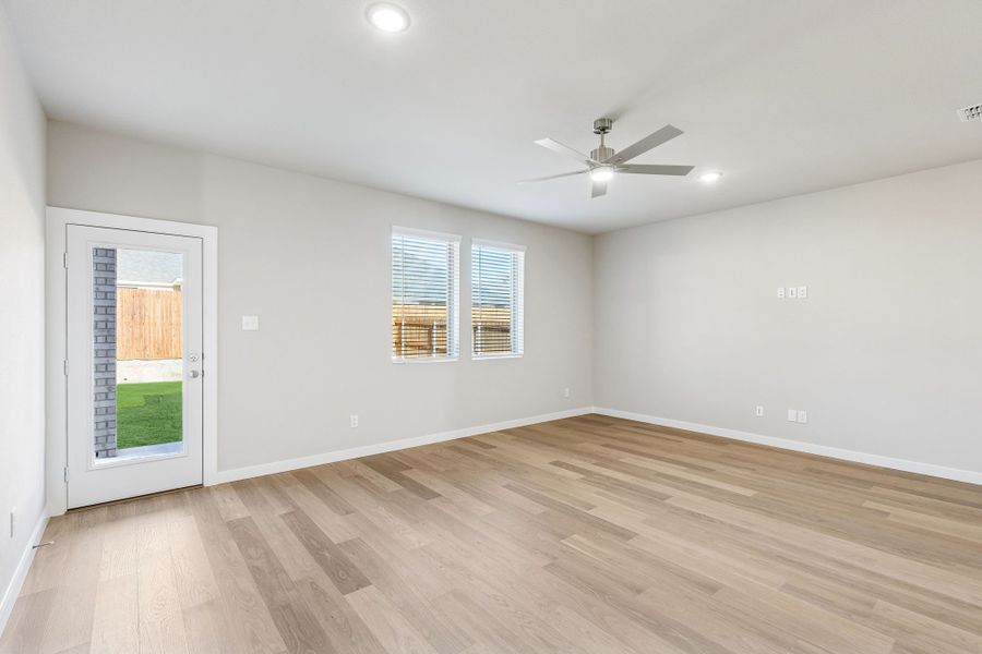 Living Room in the Haylee home plan by Trophy Signature Homes - REPRESENTATIVE PHOTO
