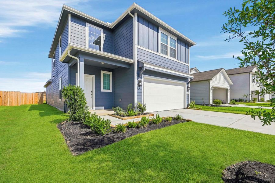 Front exterior of a new home in Barrett Crossing, Crosby, TX, highlighting curb appeal (Image 18).