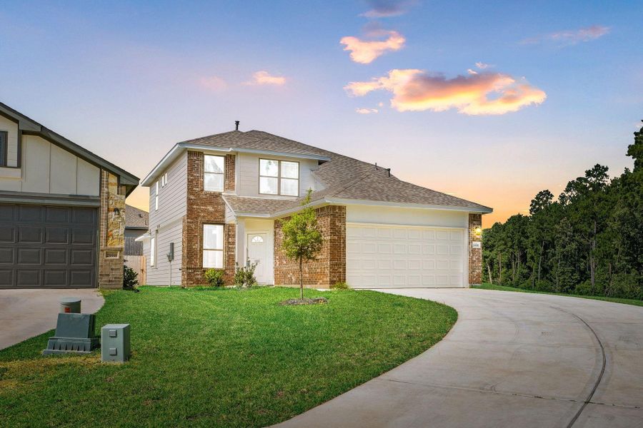 Front exterior of a new home in Magnolia Springs, Montgomery, TX, highlighting curb appeal (Image 1). Front exterior of a new home in Magnolia Springs, Montgomery, TX, highlighting curb appeal (Image 1).