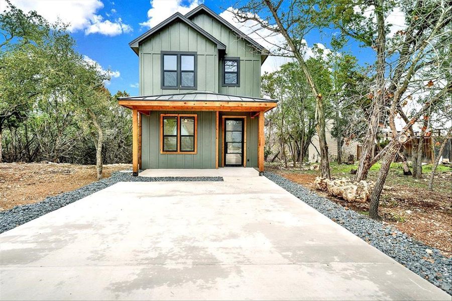 Front exterior of a new home in , Wimberley, TX, highlighting curb appeal (Image 2).