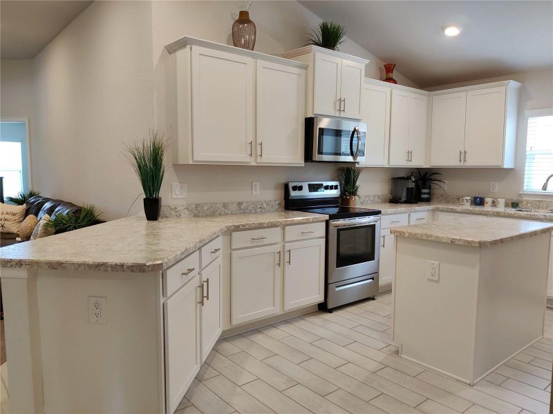 Furnished interior view inside a new home in Sunset Landing, Spring Hill (Image 10).