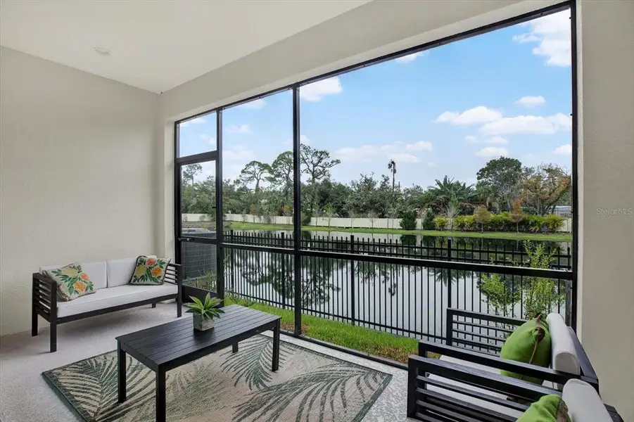 Exterior details and patio area of a home in The Towns At Long Bayou, Seminole (Image 3).