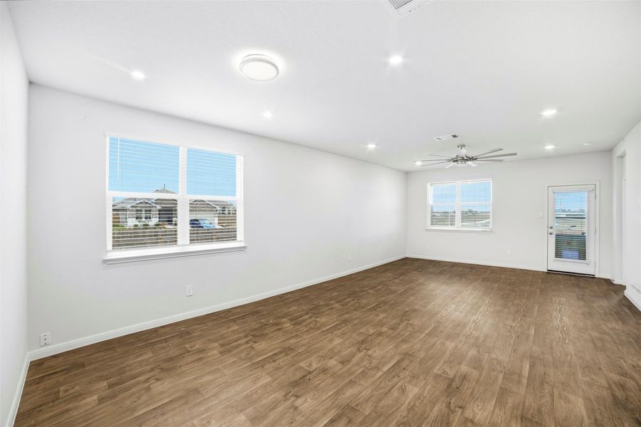 Unfurnished room featuring dark wood finished floors, recessed lighting, and a ceiling fan Unfurnished room featuring dark wood finished floors, recessed lighting, and a ceiling fan