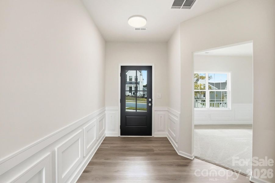 As you step inside, you are immediately greeted by an open-concept floor plan defined by soaring ceilings and an abundance of natural light streaming through oversized windows that frame the spectacular water views