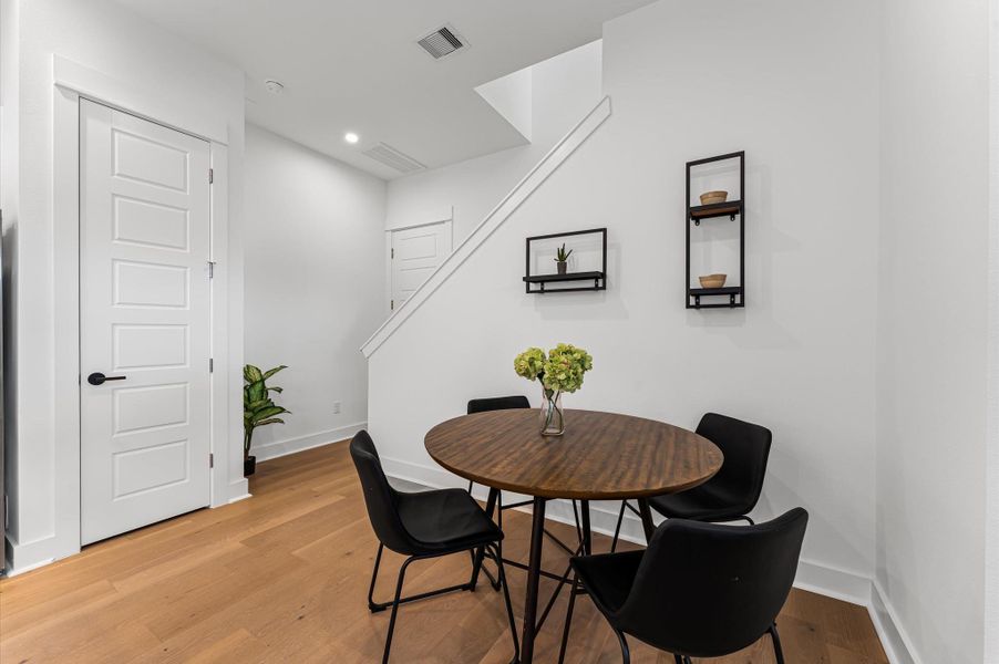 This inviting home features a spacious open-concept layout on the first floor, seamlessly connecting the living, dining, and kitchen areas to create a warm and functional gathering space. Large windows and glass door direct access to the backyard flooding the interior with natural light and extending the living space outdoors, perfect for entertaining or relaxing in the fresh air. The thoughtful design balances comfort and flow, making everyday living feel effortlessly connected to nature.