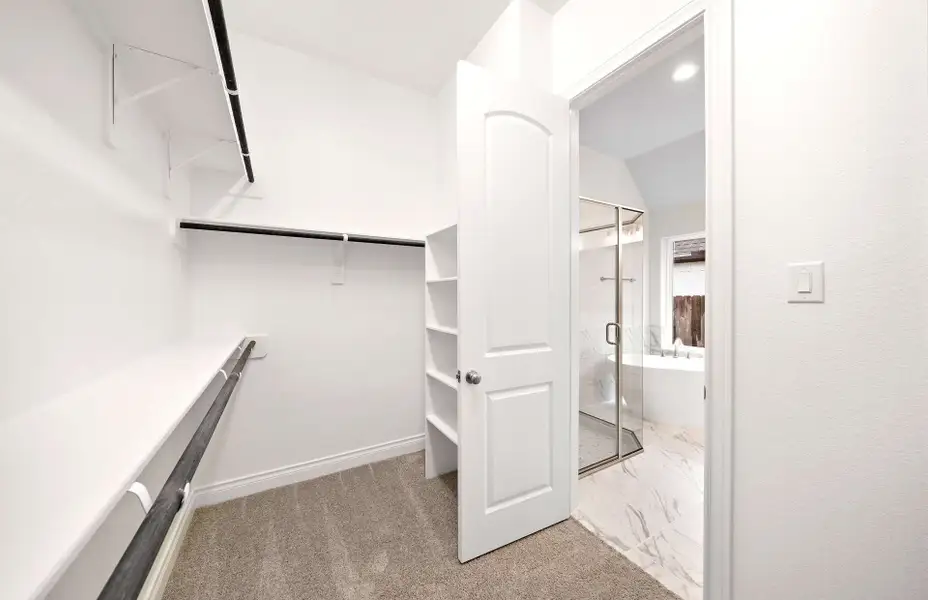 Representative furnished interior of a home built from the 3068 by Ravenna Homes in The Woodlands Hills 65′, Willis (Image 16).