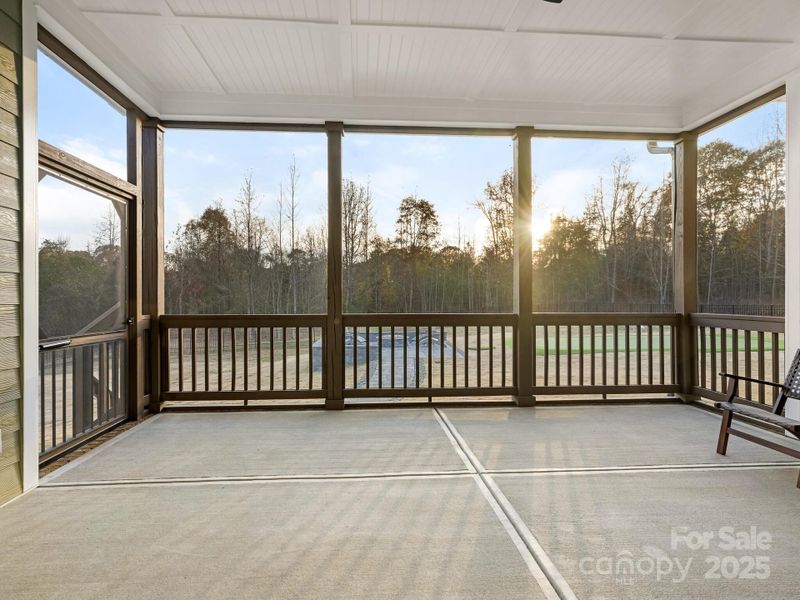 Screened-in porch w/view of gas fire pit and private putting green