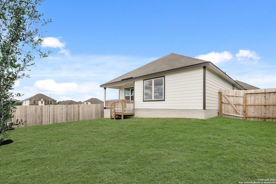 Front exterior of a new home in Hunters Ranch, San Antonio, TX, highlighting curb appeal (Image 20).