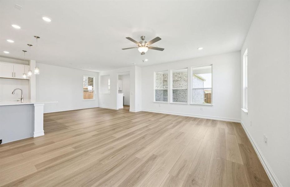 Open concept gathering room creating a spacious and inviting atmosphere  *Real home pictured