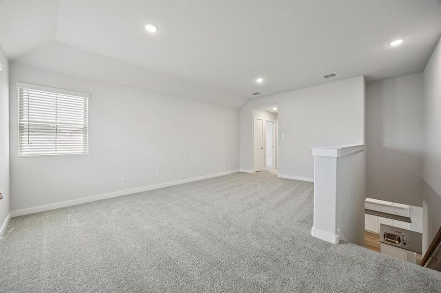 Game Room in the Haylee home plan by Trophy Signature Homes - REPRESENTATIVE PHOTO