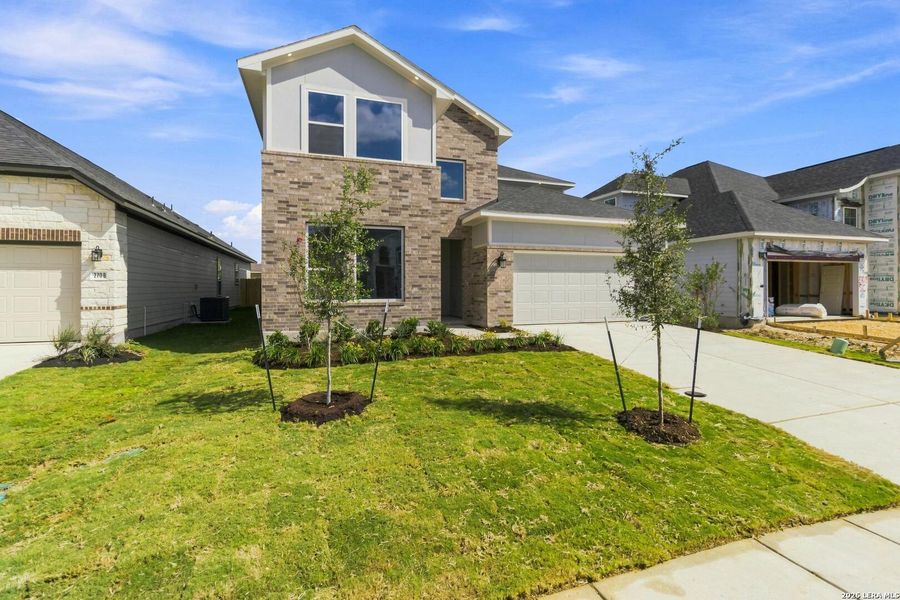 Front exterior of a new home in Cordova Crossing, Seguin, TX, highlighting curb appeal (Image 26). Front exterior of a new home in Cordova Crossing, Seguin, TX, highlighting curb appeal (Image 26).