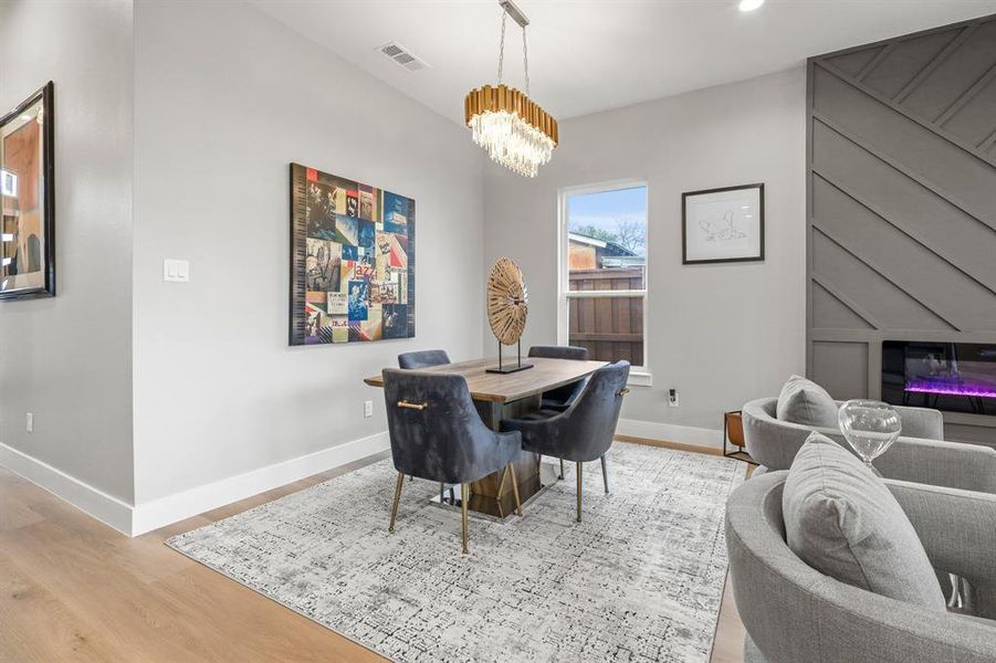 Dining area featuring a chandelier and light hardwood / wood-style flooring