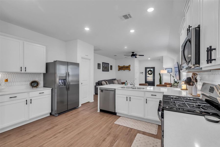 Lots of storage for all your kitchen needs. Plenty of room for all your essentials plus a cute coffee bar to the left of the refrigerator. This refrigerator is included in this sale.