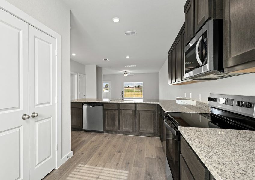 The kitchen has sprawling granite countertops.