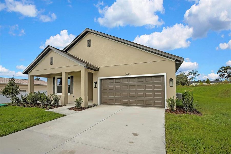 Front exterior of a new home in , Weeki Wachee, FL, highlighting curb appeal (Image 1). Front exterior of a new home in , Weeki Wachee, FL, highlighting curb appeal (Image 1).