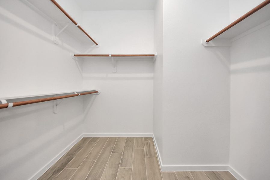 Spacious walk in closet in Primary Suite Spacious walk in closet in Primary Suite