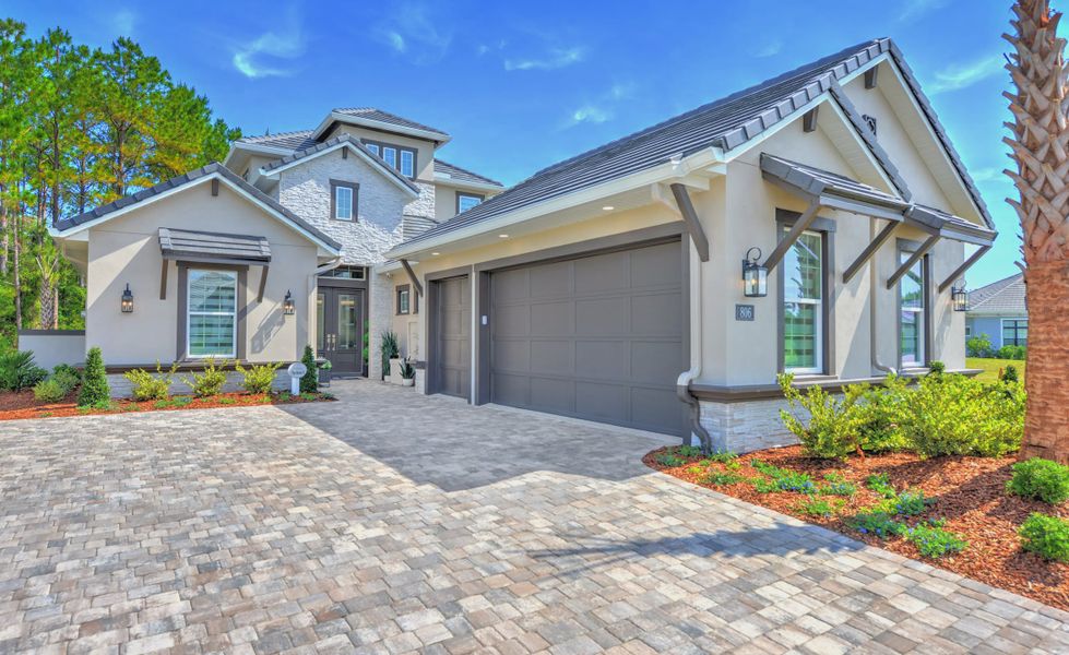 Front exterior of a new home in The Conservatory at Hammock Beach, Palm Coast, FL, highlighting curb appeal (Image 20).