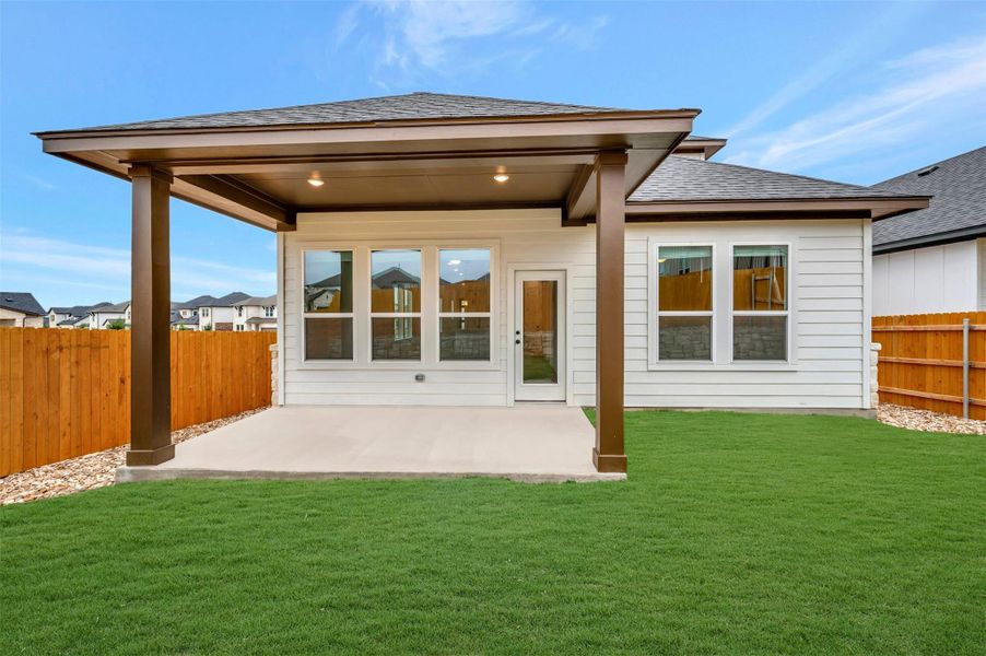 Exterior details and patio area of a home in Heritage, Dripping Springs (Image 18).