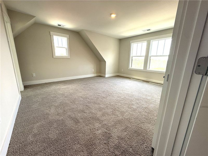 Ample natural light illuminates this spacious bedr Ample natural light illuminates this spacious bedr
