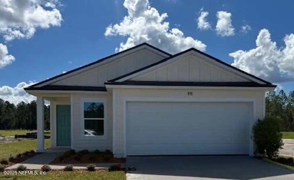 Front exterior of a new home in Grand Reserve, Bunnell, FL, highlighting curb appeal (Image 1).