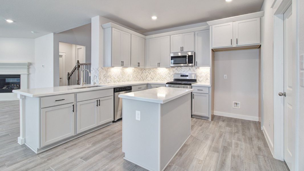 Representative furnished interior of a home built from the Majestic by Brightland Homes in Sunterra, Katy (Image 5).