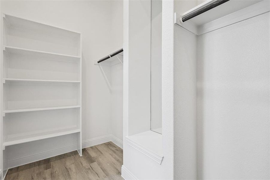 Walk in closet featuring light hardwood / wood-style flooring