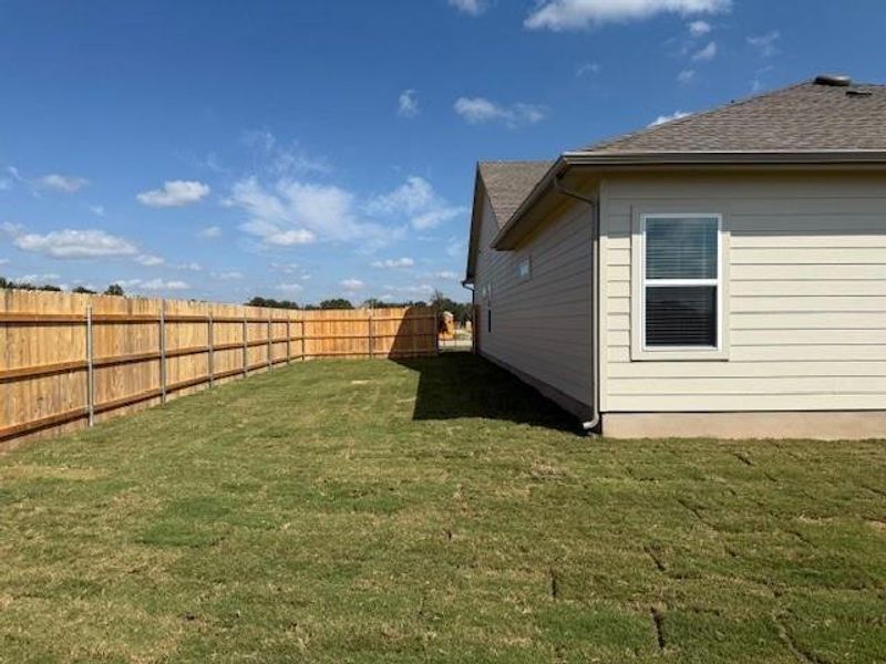 Front exterior of a new home in Grande Estates, Bertram, TX, highlighting curb appeal (Image 16). Front exterior of a new home in Grande Estates, Bertram, TX, highlighting curb appeal (Image 16).