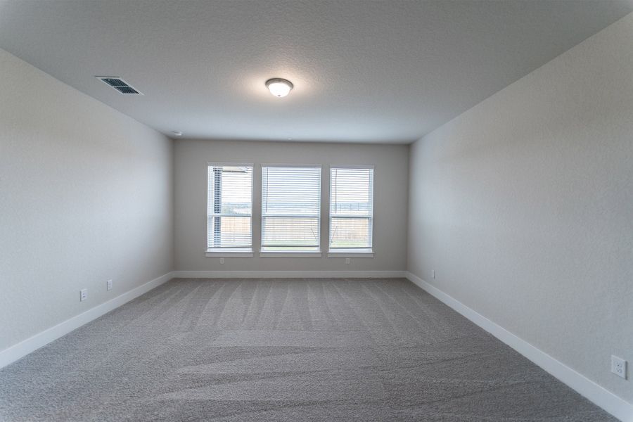 Spacious, unfurnished interior of a new home in The Woodlands at Medina Hills, Mico (Image 16).