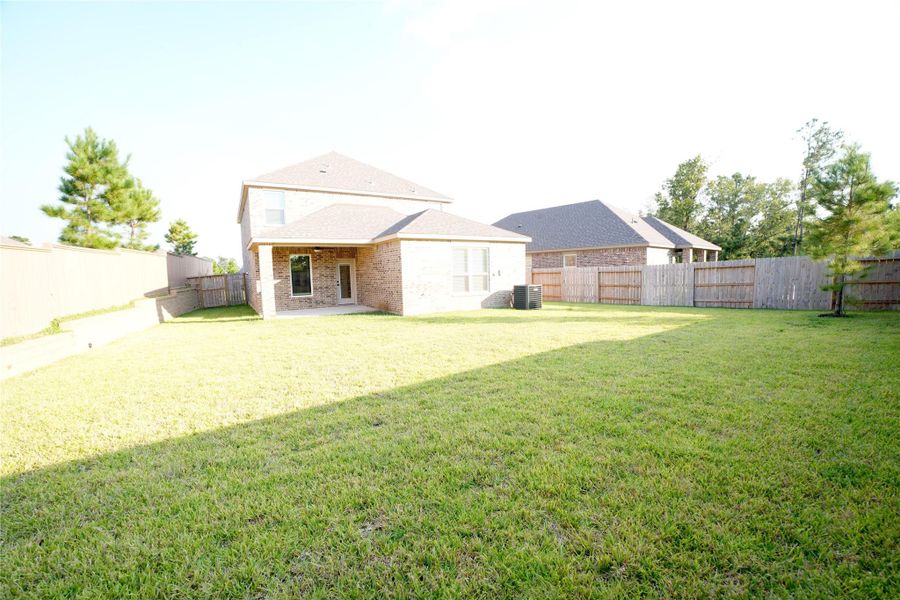 Exterior details and patio area of a home in Wedgewood Forest, Conroe (Image 14). Exterior details and patio area of a home in Wedgewood Forest, Conroe (Image 14).