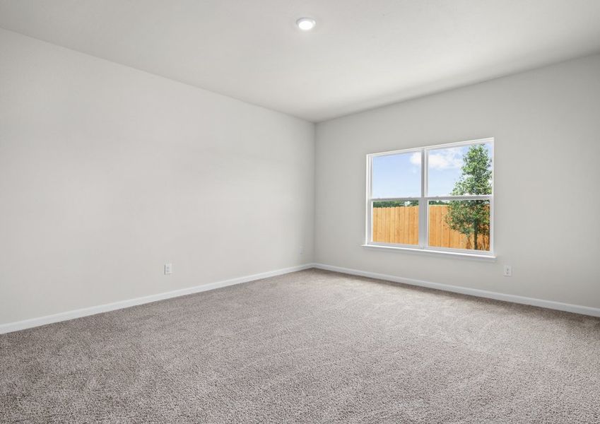 The master bedroom is spacious and has a large window.