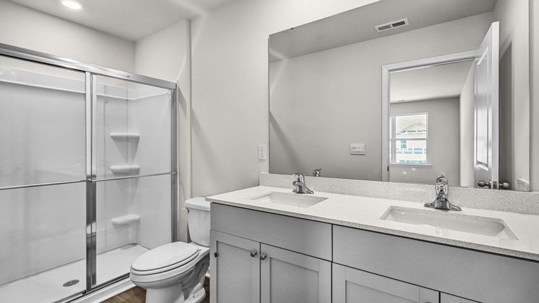 Furnished interior view inside a new home in Edinborough Townes, Gibsonville (Image 6).