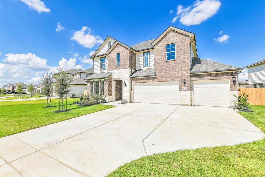 Front exterior of a new home in Stone Creek Ranch, Hockley, TX, highlighting curb appeal (Image 24).