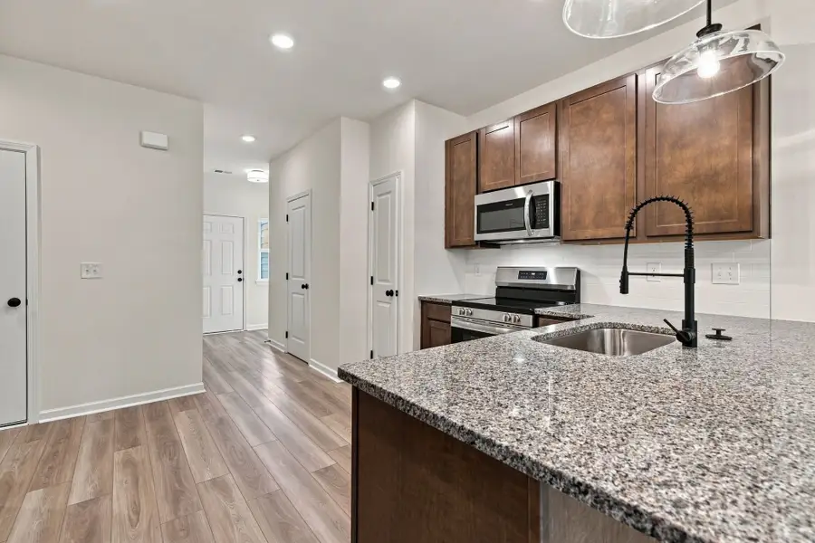 These pictures are of another unit of the same floor plan. Design selections will vary.