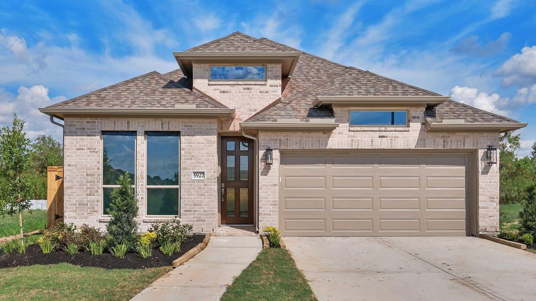 Front exterior of a new home in Valencia, Manvel, TX, highlighting curb appeal (Image 13).