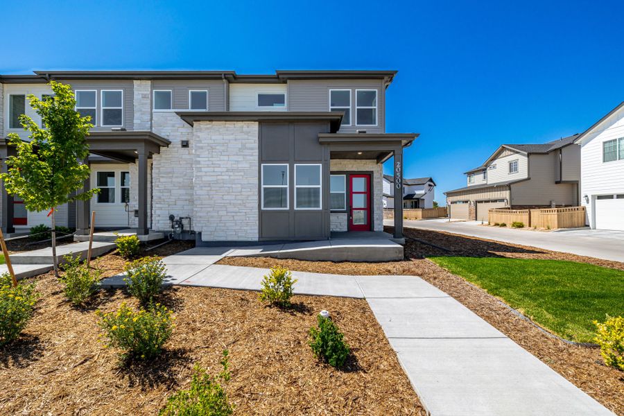 Front exterior of a new home in Painted Prairie, Aurora, CO, highlighting curb appeal (Image 2). Front exterior of a new home in Painted Prairie, Aurora, CO, highlighting curb appeal (Image 2).