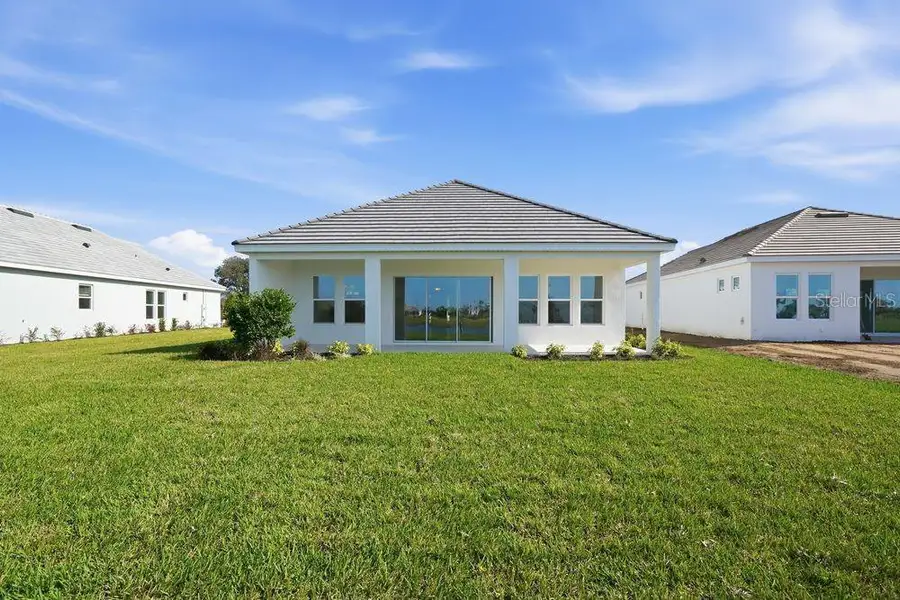 Exterior details and patio area of a home in Esplanade at Coasterra, Palmetto (Image 4).